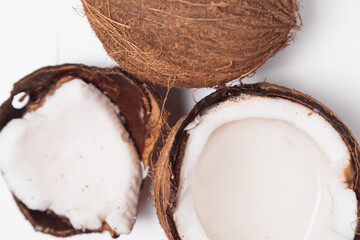 Coconuts with coconut half isolated on a white background.