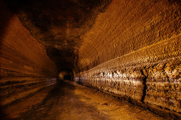 Abandoned prospecting adit. Tunnel at limestone at abandoned mine