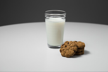 healthy oat and chocolate chip cookies with a glass of milk