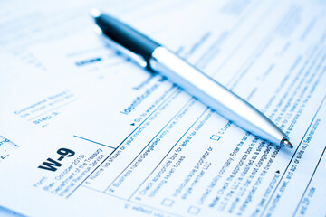 Naklejka na ściany i meble Income tax form and pen. Finance concept.