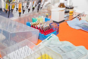 dental instrument. dental drills, grinding abrasives, diamond crowns.Set of metallic dentist tools. Dentist clinic. Selective focus.Needles for dilation and cleaning of dental canals.