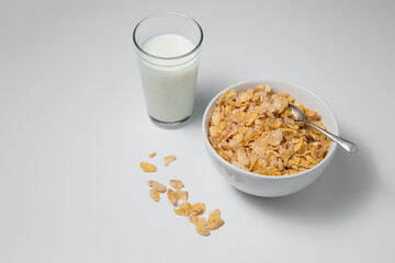 Healthy breakfast with cornflakes and milk on isolated background