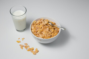Healthy breakfast with cornflakes and milk on isolated background