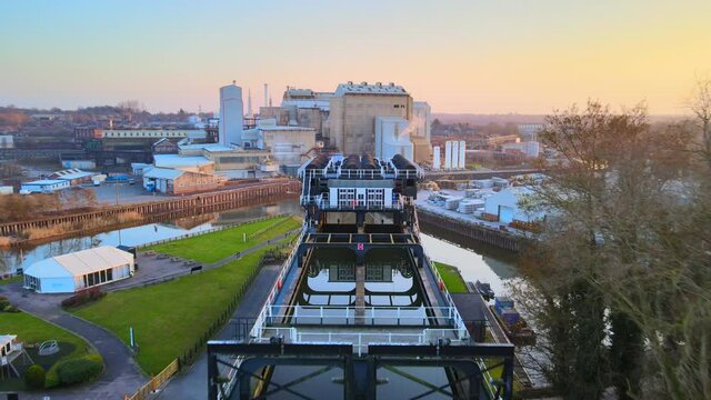 The Anderton Boat Lift is a two caisson lift lock near the village of Anderton, Cheshire, in North West England. It provides a 50-foot vertical link between the River Weaver and Trent and Mersey Canal