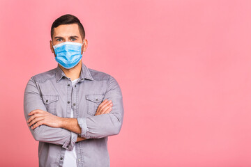 Protection against contagious disease, coronavirus, covid-19. Man wearing hygienic mask to prevent infection, airborne respiratory illness such as flu, 2019-nCoV. Isolated over pink background