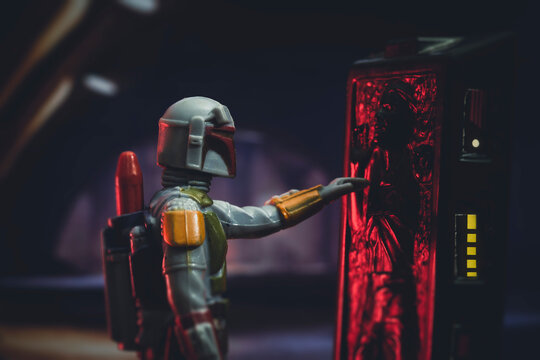 NEW YORK USA, MARCH 1 2021: scene from Star Wars The Empire Strikes Back with bounty hunter Boba Fett and Han Solo frozen in carbonite - vintage Kenner 3.75 inch action figures