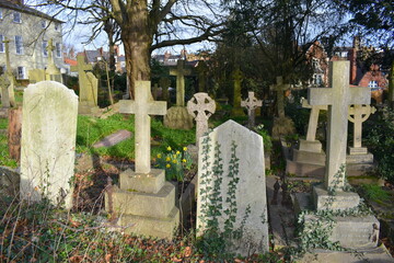 Crosses and gravestones laid out in east west alignment following the Christian custom of burying...