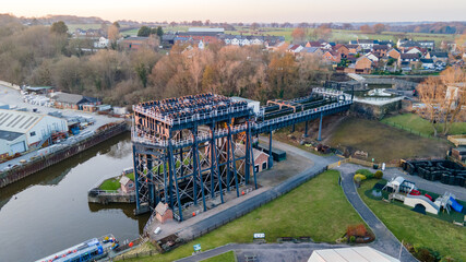 The Anderton Boat Lift is a two caisson lift lock near the village of Anderton, Cheshire, in North West England. It provides a 50-foot vertical link between the River Weaver and Trent and Mersey Canal