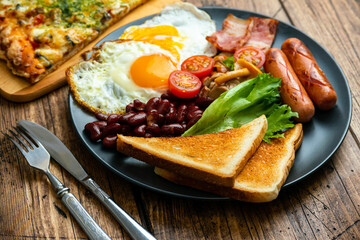 Rustical breakfast eggs, sausages, vegetables. Selective focus