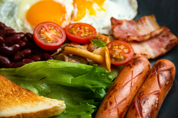 Rustical breakfast eggs, sausages, vegetables. Selective focus