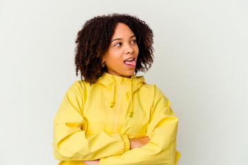 Young african american mixed race woman isolated funny and friendly sticking out tongue.