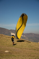 Man preparing to fly with paraglider 