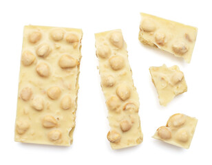 White chocolate bar with pieces isolated on white background. Top view, flat lay