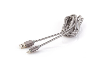 Silver-gray cable USB-Lightning for Data & Power isolated on White Background. Closeup