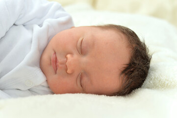 Fototapeta na wymiar cute little baby boy on bed sleeping