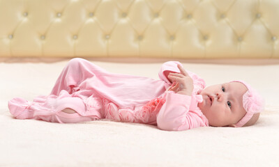 Fototapeta na wymiar cute little baby girl on bed