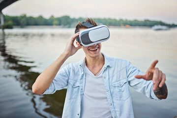 man with glasses of virtual reality on the street. Live emotions from viewing virtual reality