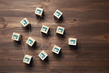 wooden cubes with franchises icon.