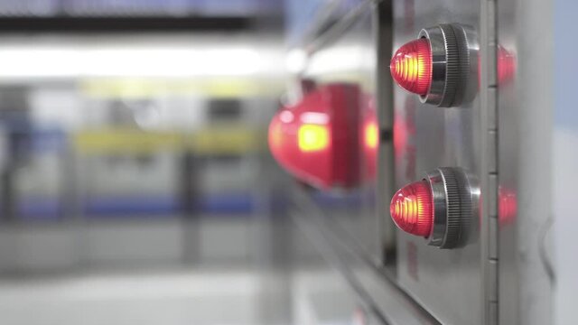 Close-up on fire fighting equipment in modern building. The lens shakes slightly. The blurred background is that the train is closed and ready to start.