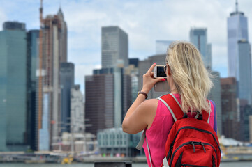 Fototapeta na wymiar woman taking picture New York city skyline