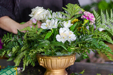 florist working making a flower arrangement