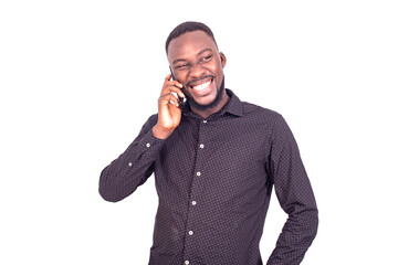 handsome young businessman in communication on cellphone, smiling.