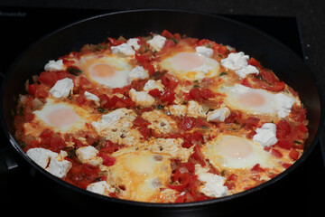 Preparing Shakshuka With Feta for dinner
