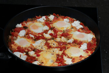 Preparing Shakshuka With Feta for dinner