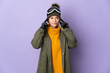 Skier Russian girl with snowboarding glasses isolated on purple background having doubts and thinking