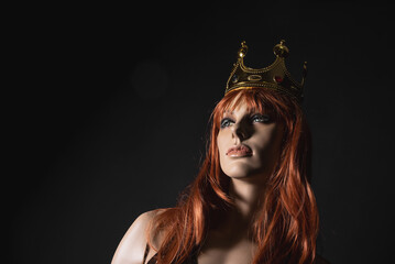 Luxury underwear store concept. Beautiful women mannequin in the black bodysuit and golden crown on her head.