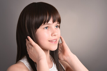 Fototapeta premium Cute happy girl with dark hair posing