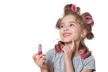 portrait of  little pretty girl with hair curlers with lipstick