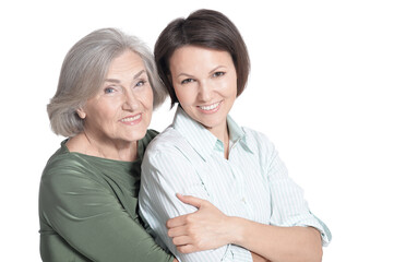 close up portrait of mother and her adult daughter hugging isolated on white