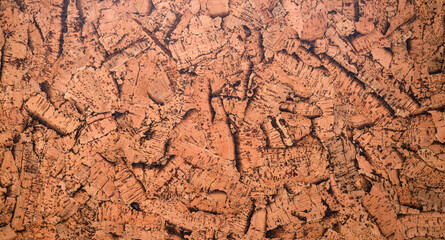 Closed up of panoramic brown cork board texture for banner background.