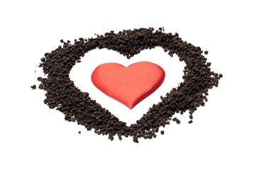 black tea granules isolated on white background. design element. heart symbol made by dry tea heap...
