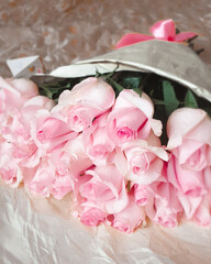 A bunch flowers of fresh light pink roses. Beautiful rose in a bud