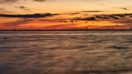 Cuba. Trinidad. Ancon. Flame of the sunset over the water surface