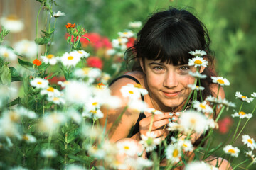 Teen girl portrait among wildflowers.