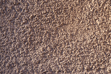 A wall of granite stone as a background.
