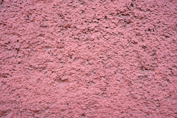 Painted pink vintage wall as a background.