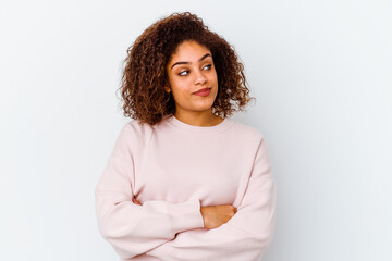 Young african american woman isolated on white background dreaming of achieving goals and purposes