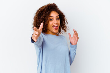 Young african american woman isolated on white background feels confident giving a hug to the camera.