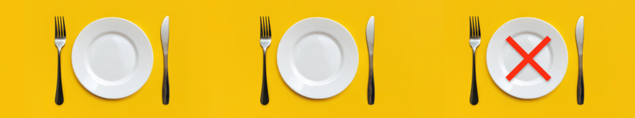 On the yellow tablecloth are three sets of white empty plates,stainless steel forks and knives.There is a red cross at the place of Dinner.Minimum serving.Intermittent fasting, diet.Copy space, mockup