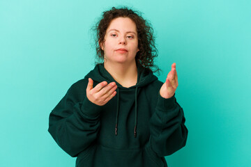 Woman with Down syndrome isolated joyful laughing a lot. Happiness concept.