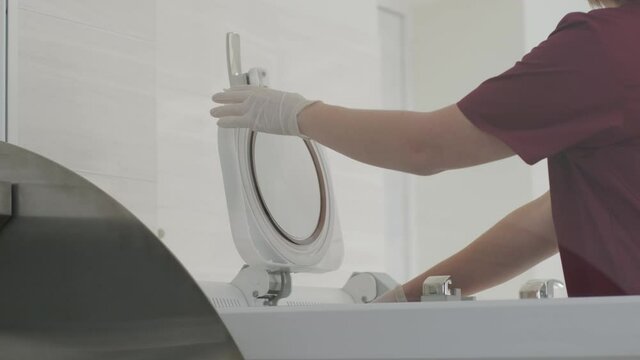 The laboratory assistant makes histological research, microtoming. Rotary Microtome Section for diagnosis in pathology make microscope slide histology. Human tissue equipment.