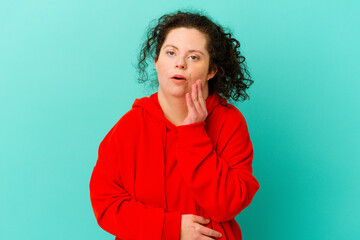 Fototapeta premium Woman with Down syndrome isolated having some great idea, concept of creativity.