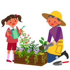 寄せ植えを作るシニア女性と孫