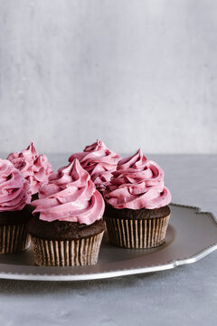 Chocolate cupcakes with black currant marshmallow frosting.