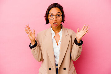 Young business mixed race woman isolated on pink background having an idea, inspiration concept.