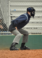 Baseball or Softball umpire calling balls and strikes during a game
